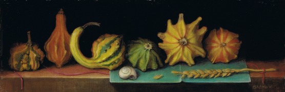 Gourds, wheat and snail on a table