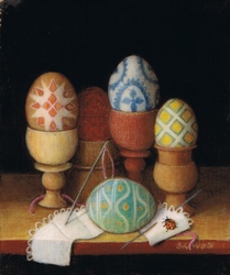 Painted eggs in wooden antique egg cups